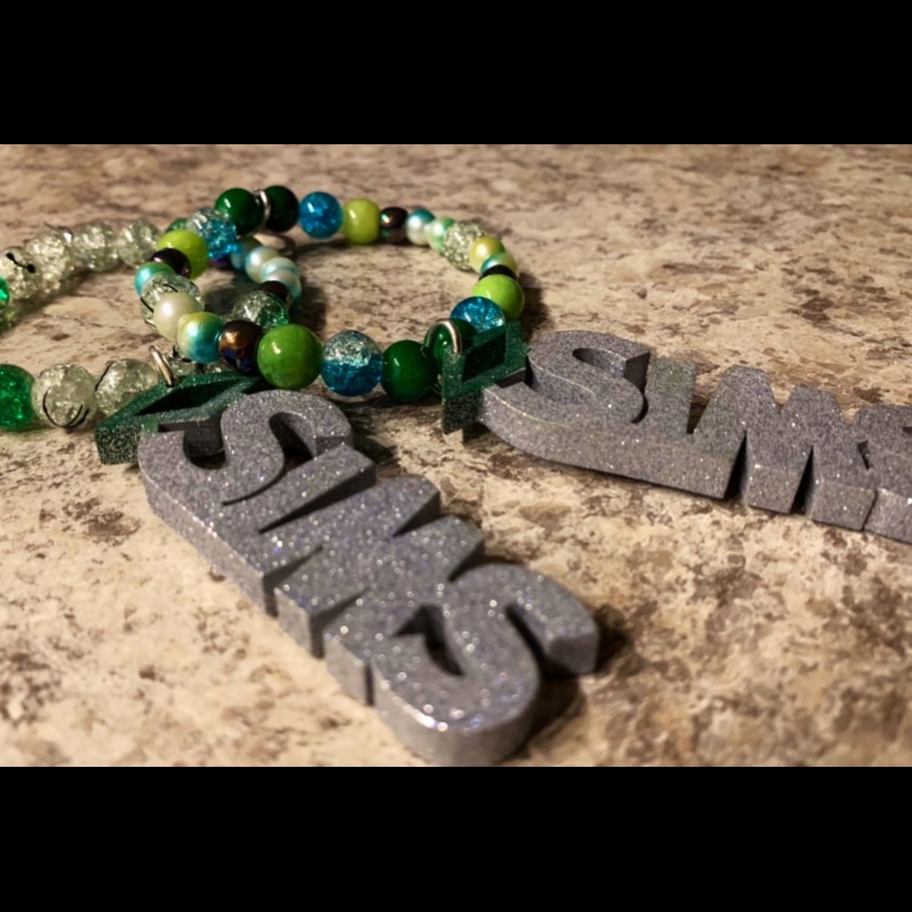 The Sims Logo Keychain